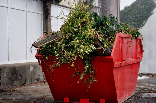 Person using a screen reader and keyboard to arrange waste clearance services